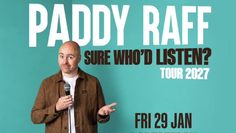 PAddy Raff in fron t of turquise back ground