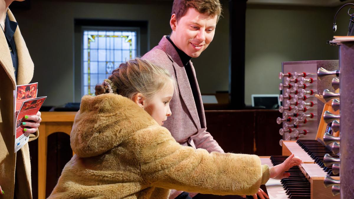 Young girl plays organ