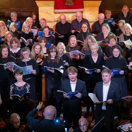 The New Quay singers perfroming on stage at Portico.